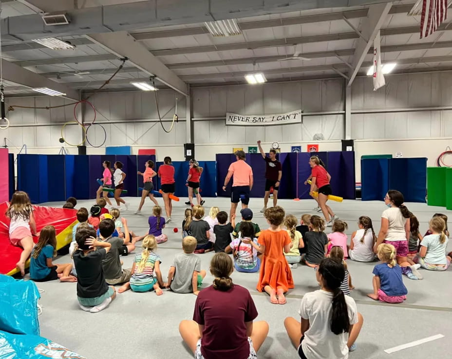 a group of people in a gym