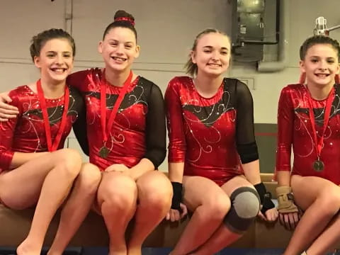 a group of women in red uniforms