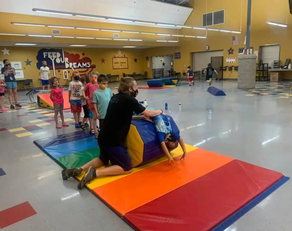a group of people in a gym