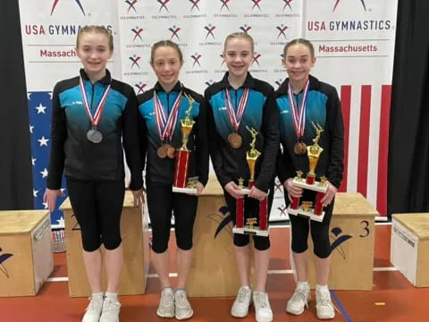 a group of people wearing medals