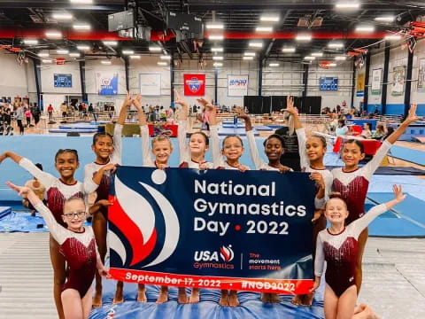 a group of people holding a sign