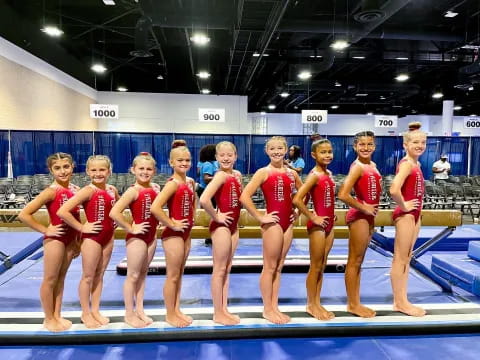 a group of women in red uniforms