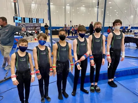 a group of people wearing masks