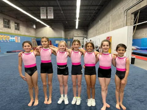 a group of girls posing for a photo