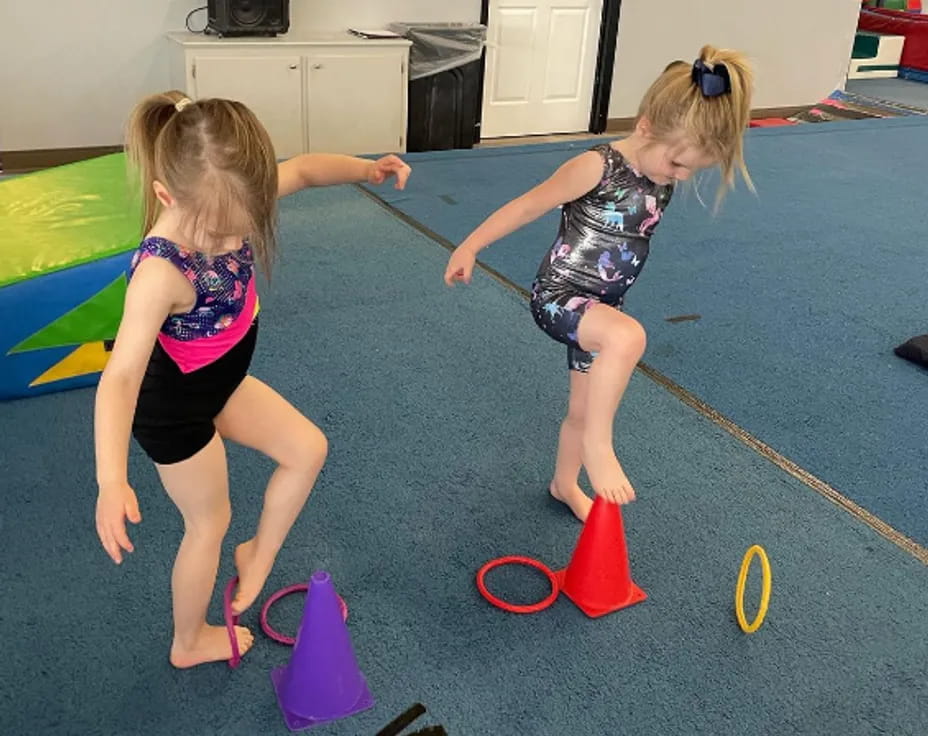 two girls playing with toy blocks