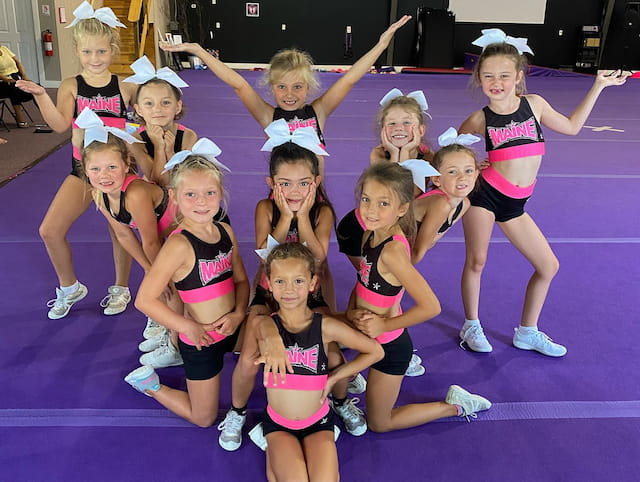 a group of girls posing for a photo