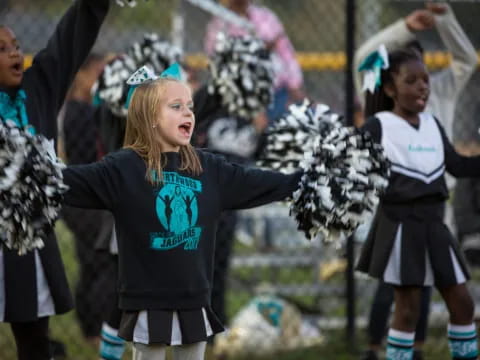 a group of girls wearing clothing