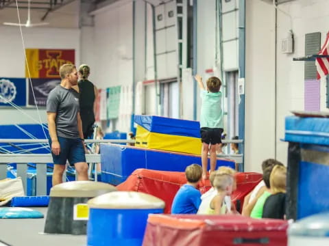 a group of people playing on a trampoline