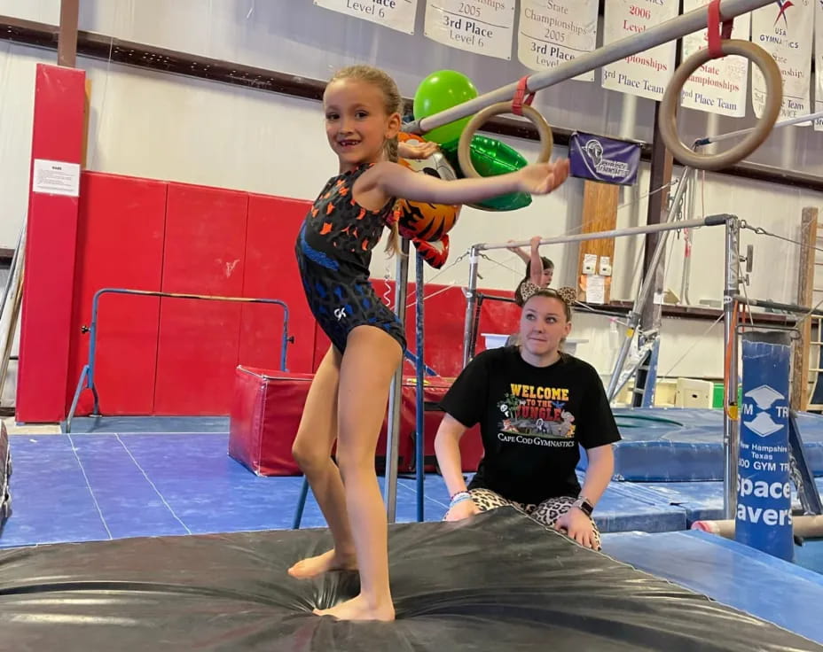 a woman standing on a pole