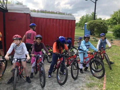 a group of kids on bicycles