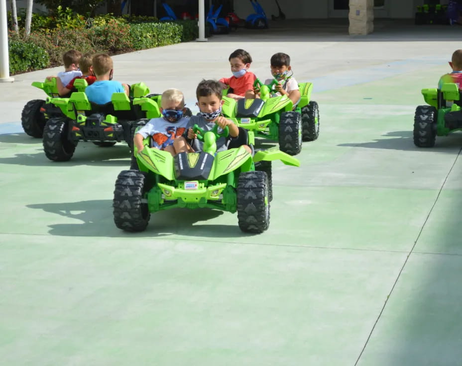 kids riding toy cars