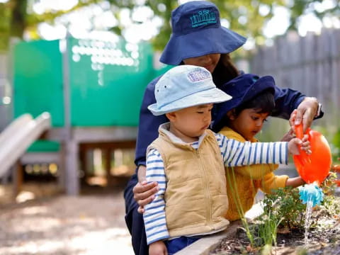 a group of kids holding plants
