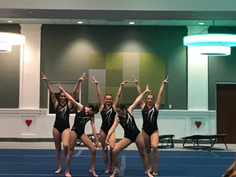 a group of girls in black uniforms