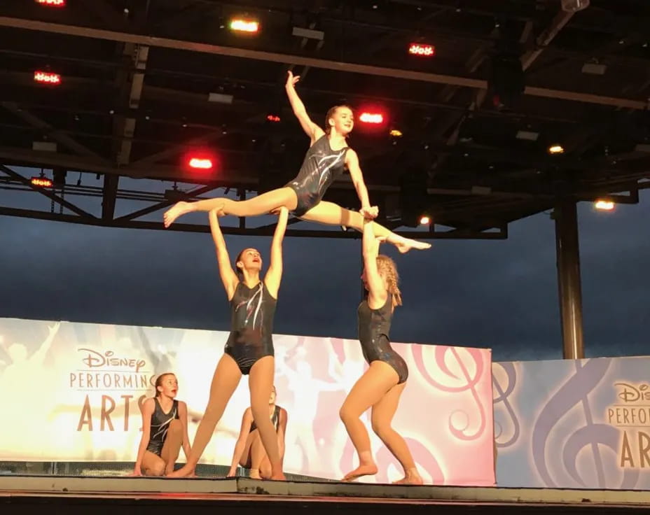 a group of women performing on a stage