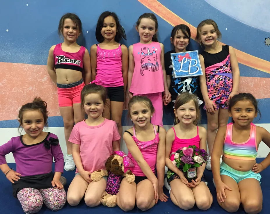 a group of girls posing for a photo