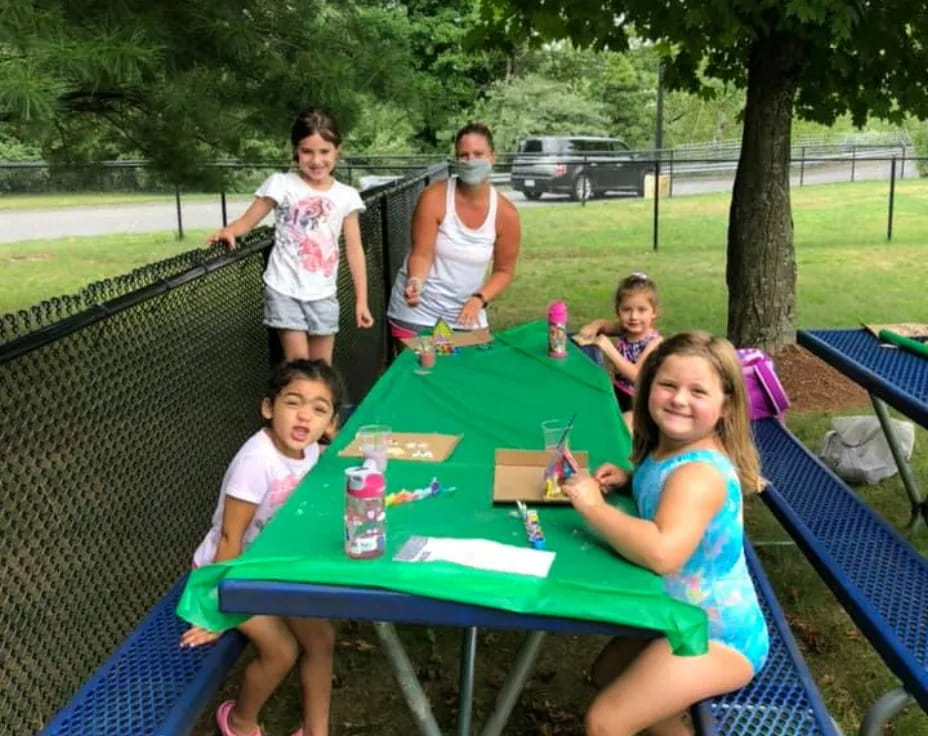 a group of people around a table
