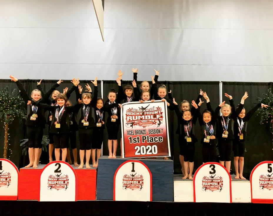 a group of women holding a sign