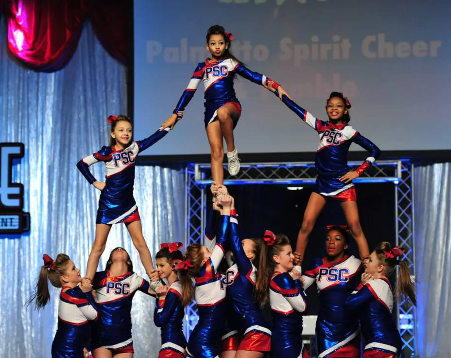 a group of cheerleaders on a stage