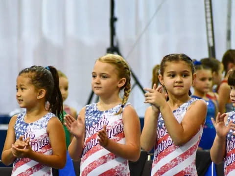 a group of girls in dresses