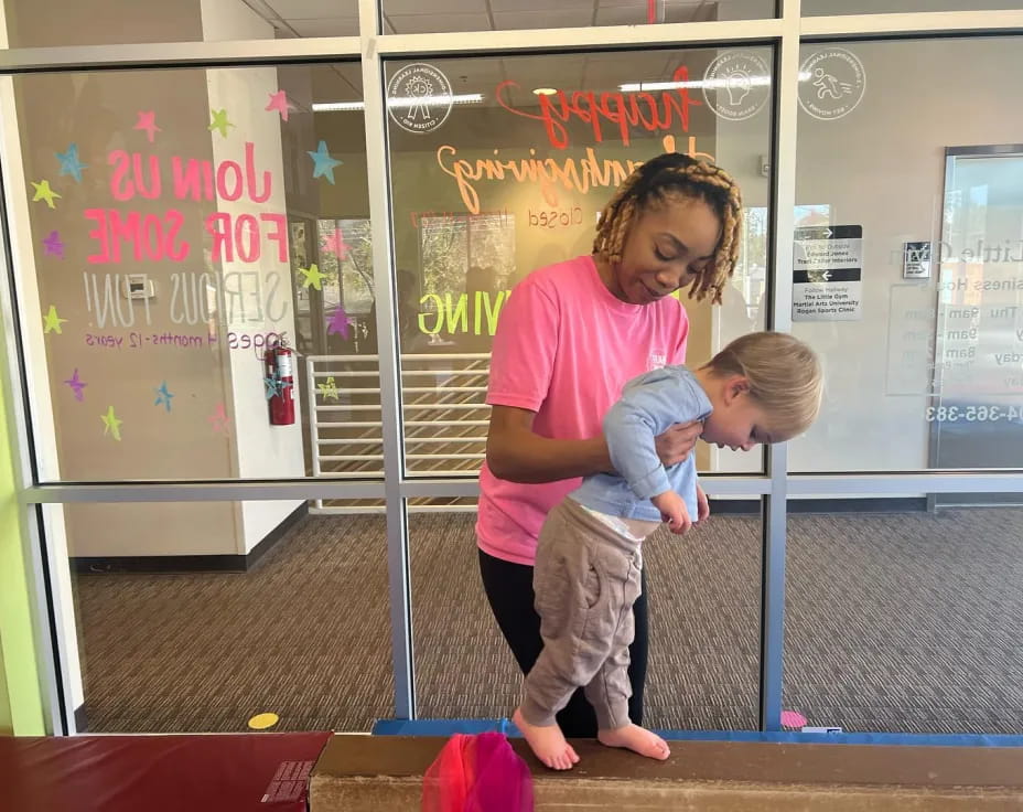 a person holding a child