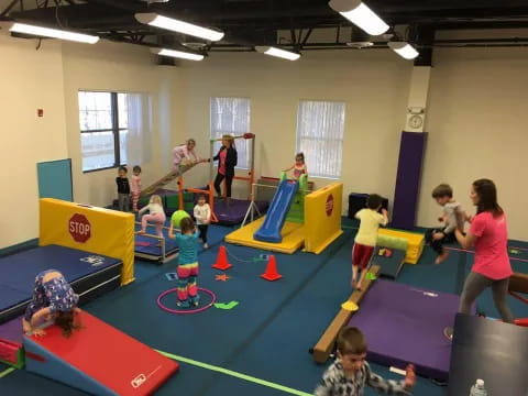 a group of people playing on mats