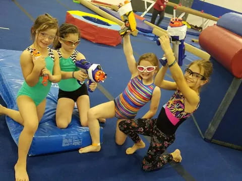 a group of children on a blue slide