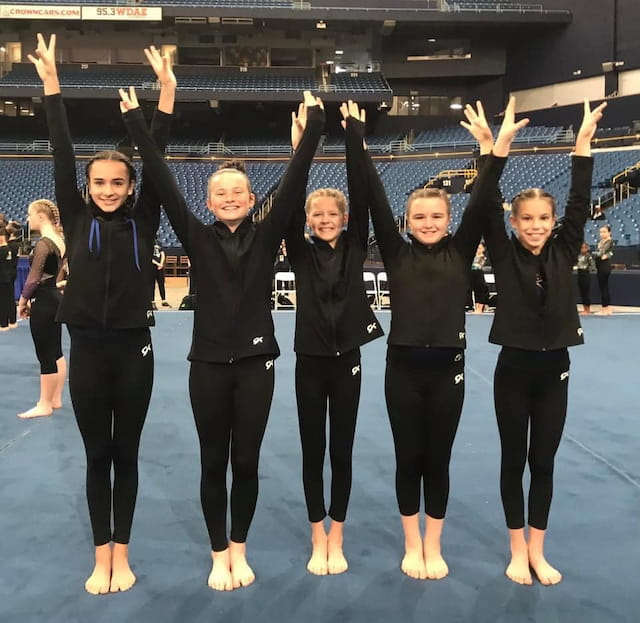 a group of women in black