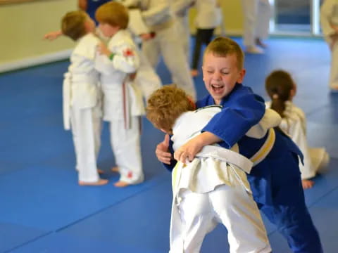 a group of children in karate uniforms