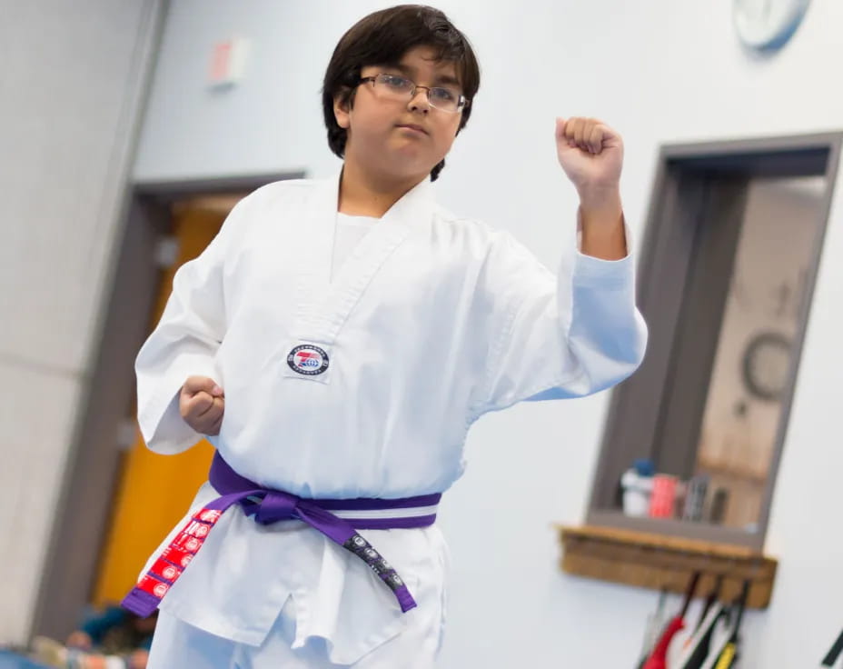 a boy wearing a karate uniform