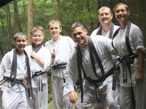 a group of men wearing suspenders