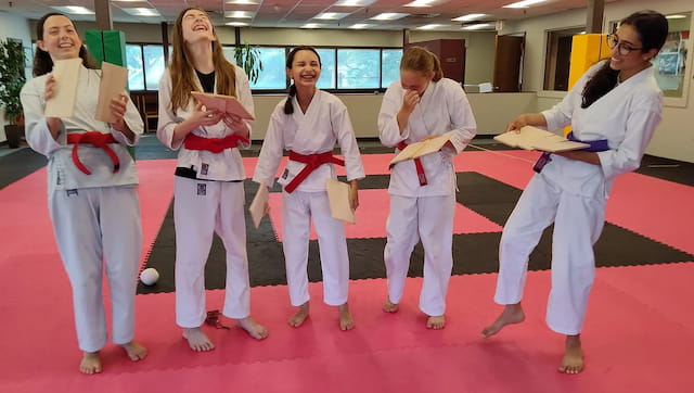 a group of people in karate uniforms