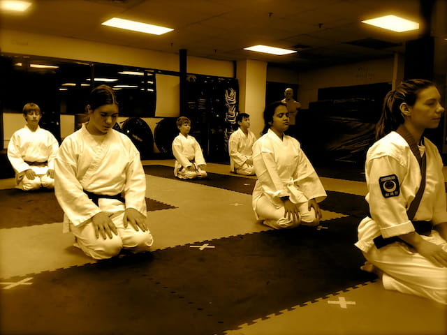 a group of people in white uniforms