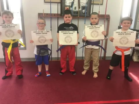 a group of kids holding signs