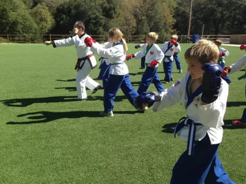 a group of kids playing football