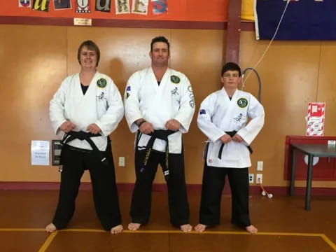 a group of men in karate uniforms