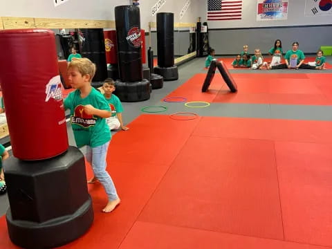 a boy and a girl in a gym