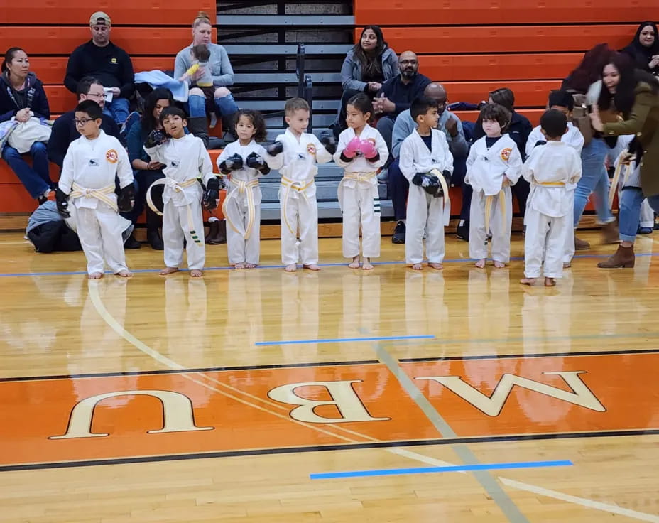 a group of people in white uniforms