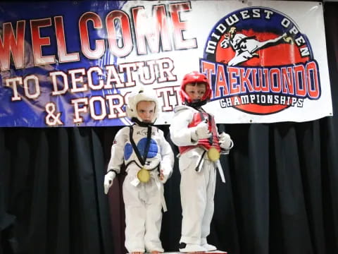 a group of people in white suits