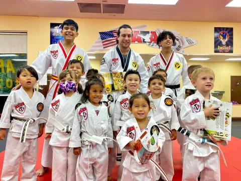 a group of people in karate uniforms