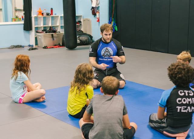 a group of people sitting on the floor