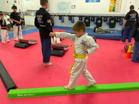 a boy in a karate uniform