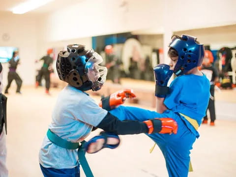 two people in blue fighting