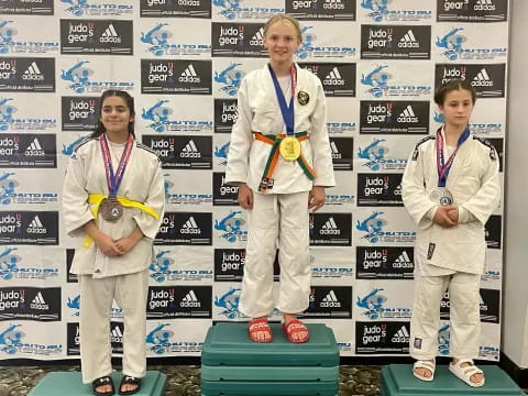 a group of women wearing medals