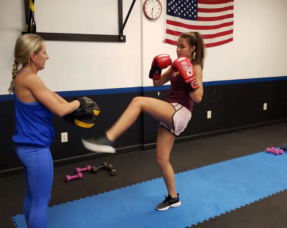 a couple of women in boxing gloves