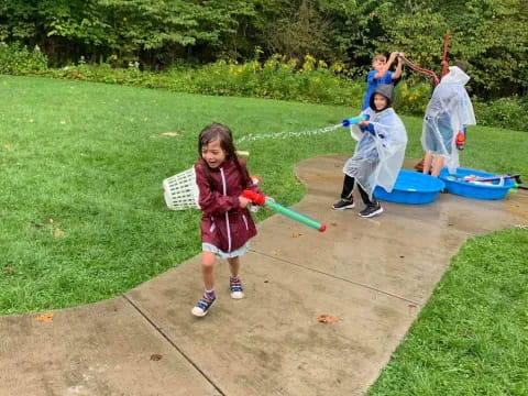 a group of kids playing in a yard