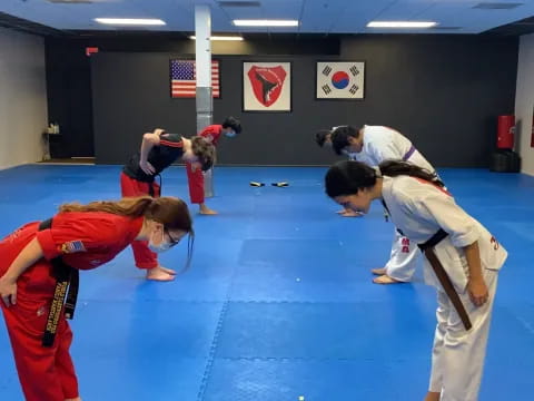 a group of people in a martial arts class