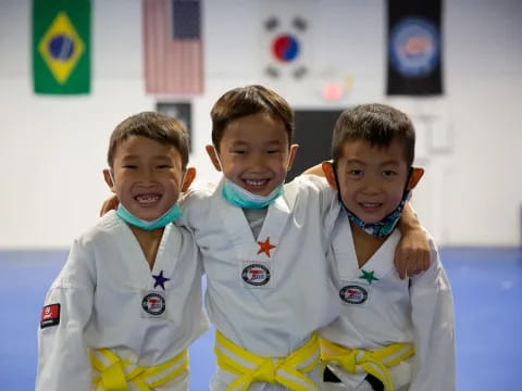 a group of boys in white uniforms