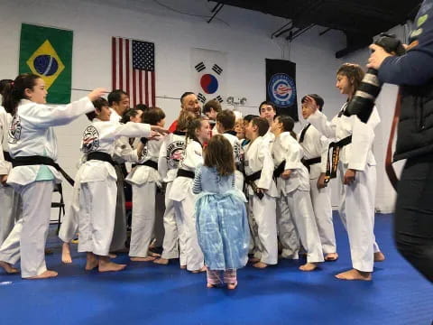 a group of people in karate uniforms