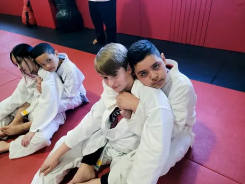 a group of people in karate uniforms