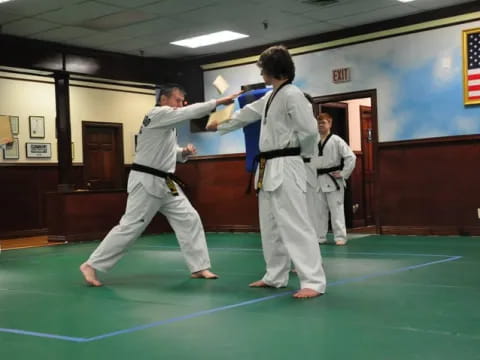 a group of people in karate uniforms